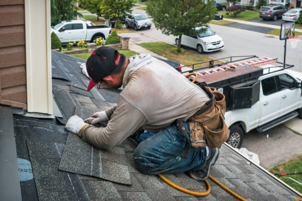 Professional Roofing technician working in Port Jefferson Station, NY